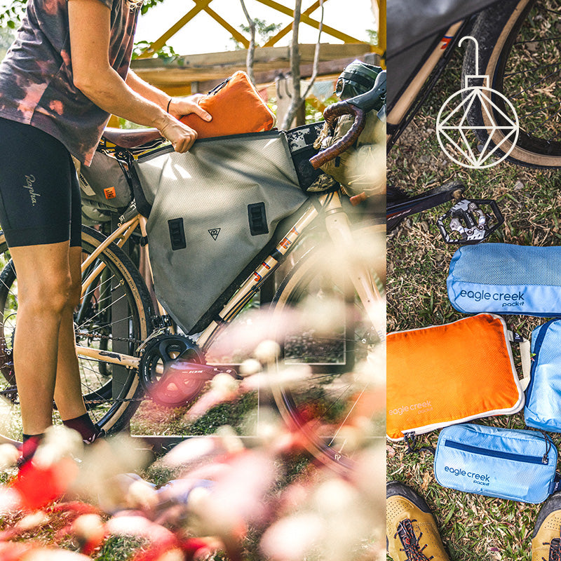 A woman packs her bicycle with packing cubes