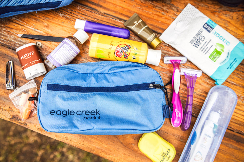 Spread of toiletries that can fit inside a Pack-It® travel organizer